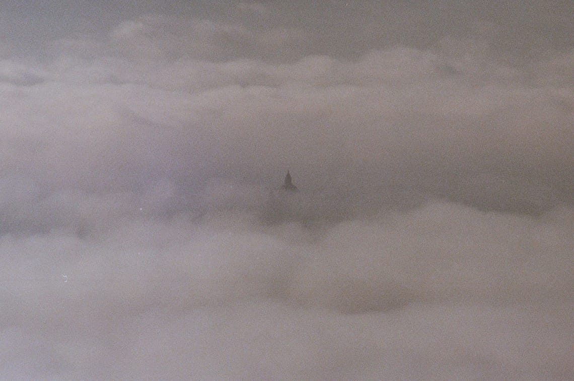 Assisi breaking through the clouds