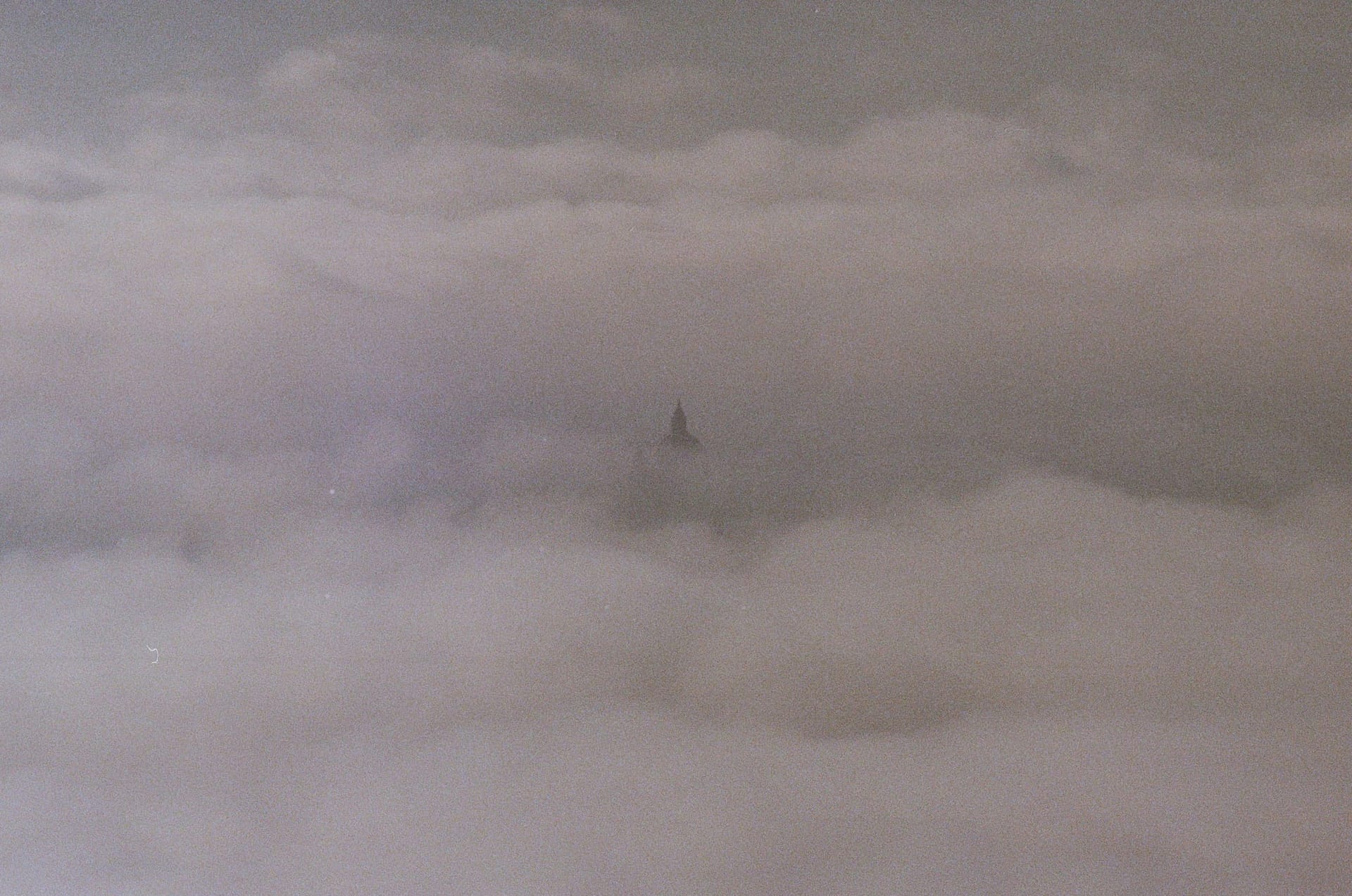 Assisi breaking through the clouds